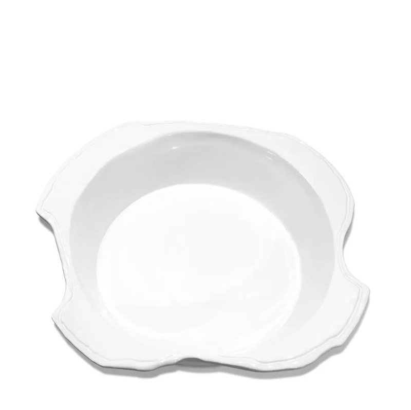 The Montes Doggett 5442-L Bowl No.442L is a white, high-fired ceramic bowl with a slightly scalloped, irregular rim, handmade in Peru and shown against a plain white background.