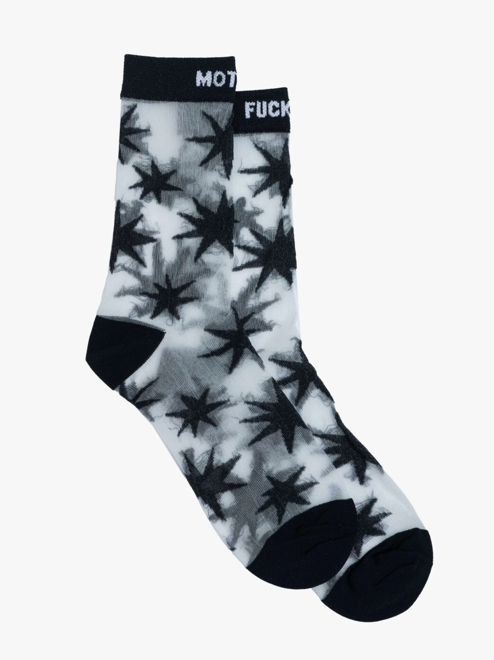 The Step Up Sock by Mother highlights a bold black and white star pattern, complete with a top band that features partially visible text on a dark background. Laid flat on a white surface, these socks combine style and comfort with every step.