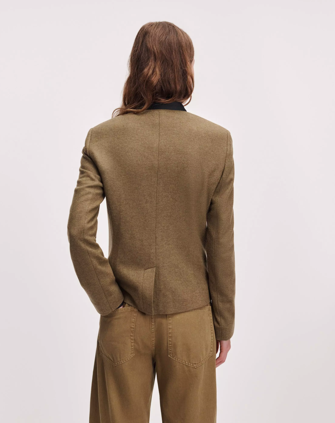 Rag &amp; Bone Mercer Regalia Blazer in navy with tan pants, back view, plain background.