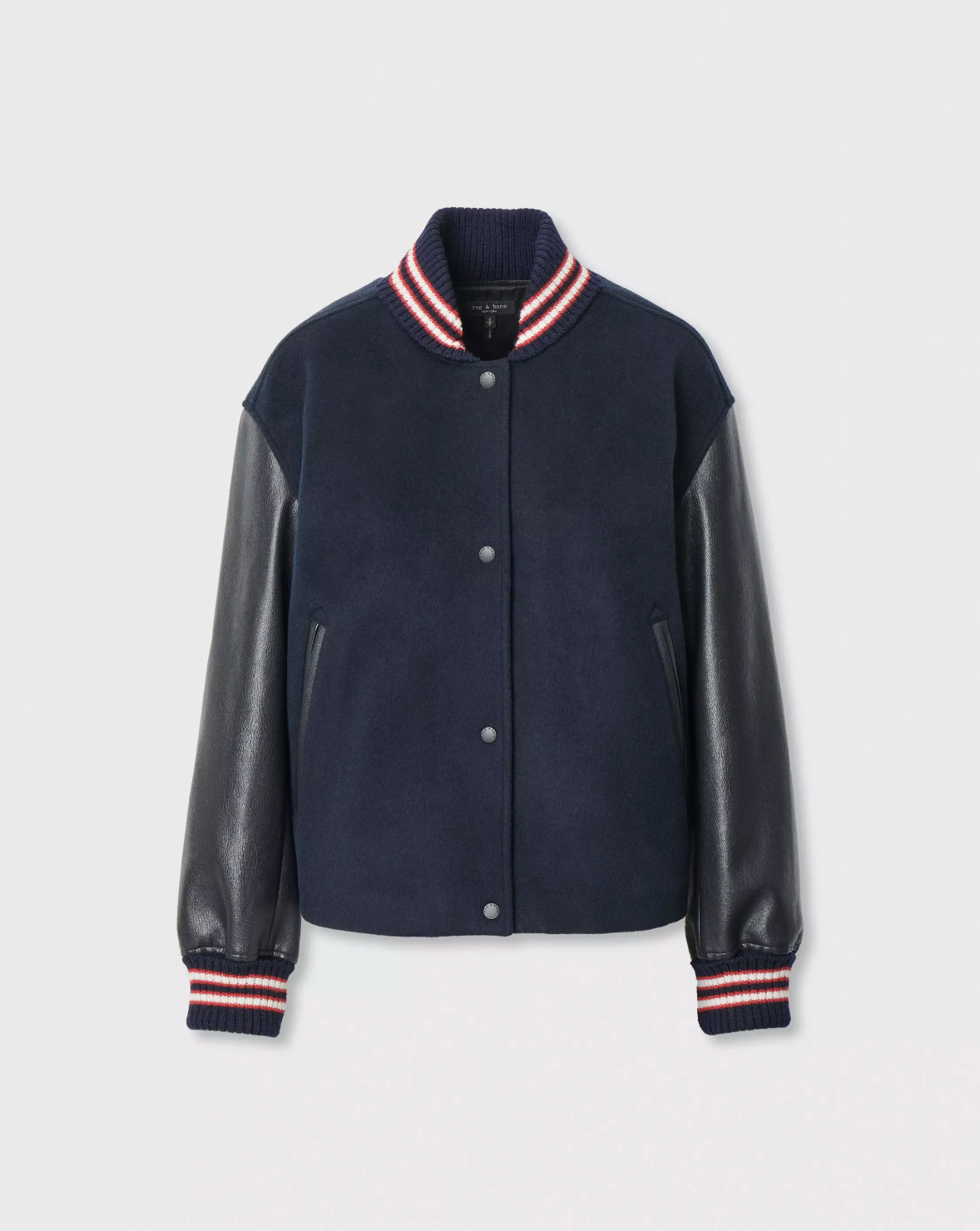 Scarlet varsity jacket with black faux leather sleeves and striped cuffs by Rag & Bone, laid flat.