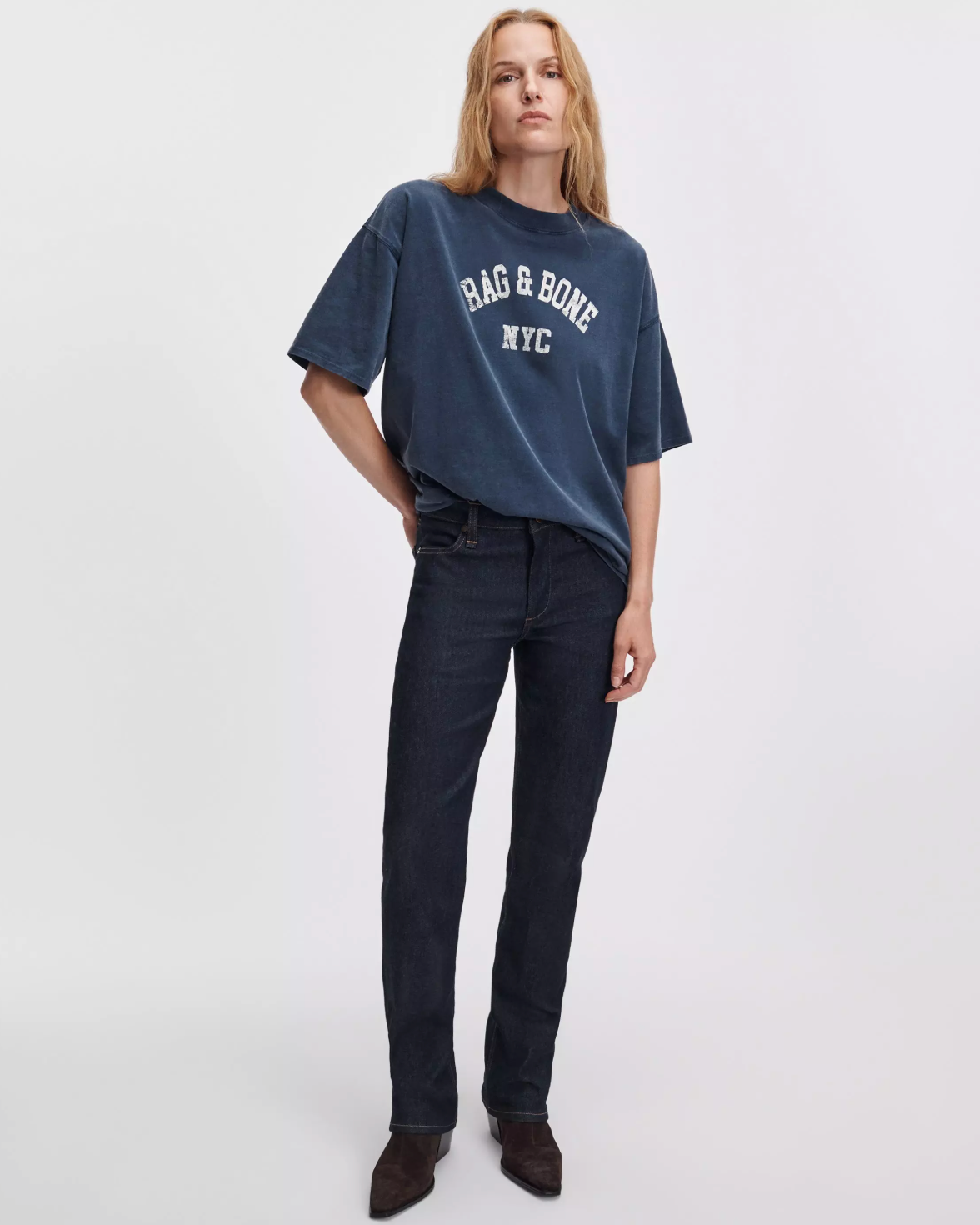 Rag & Bone university alex tee in white, styled with dark jeans against a plain background.