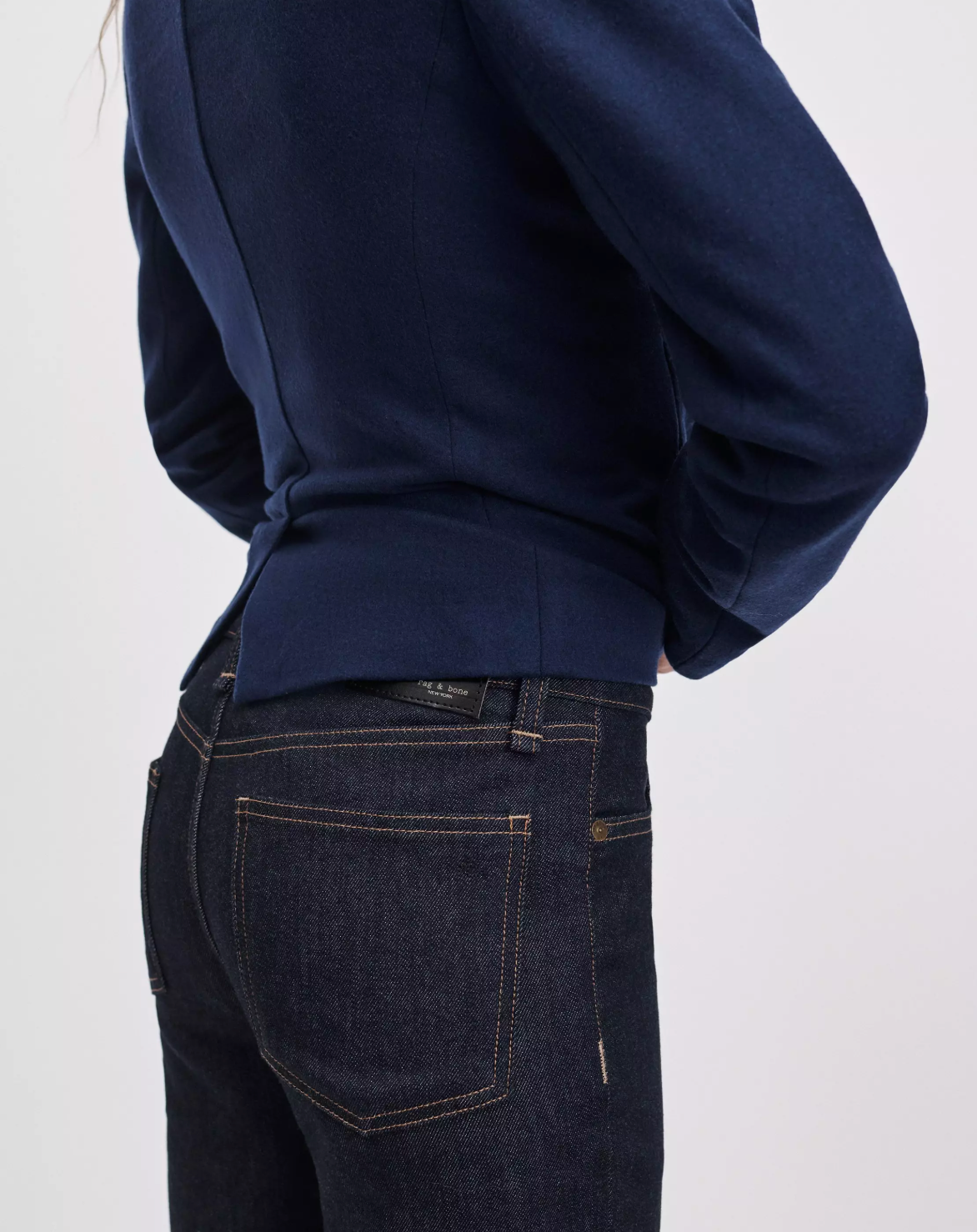 Rag & Bone Sutton Cigarette Jean in blue denim and navy blazer, back view against a light background.