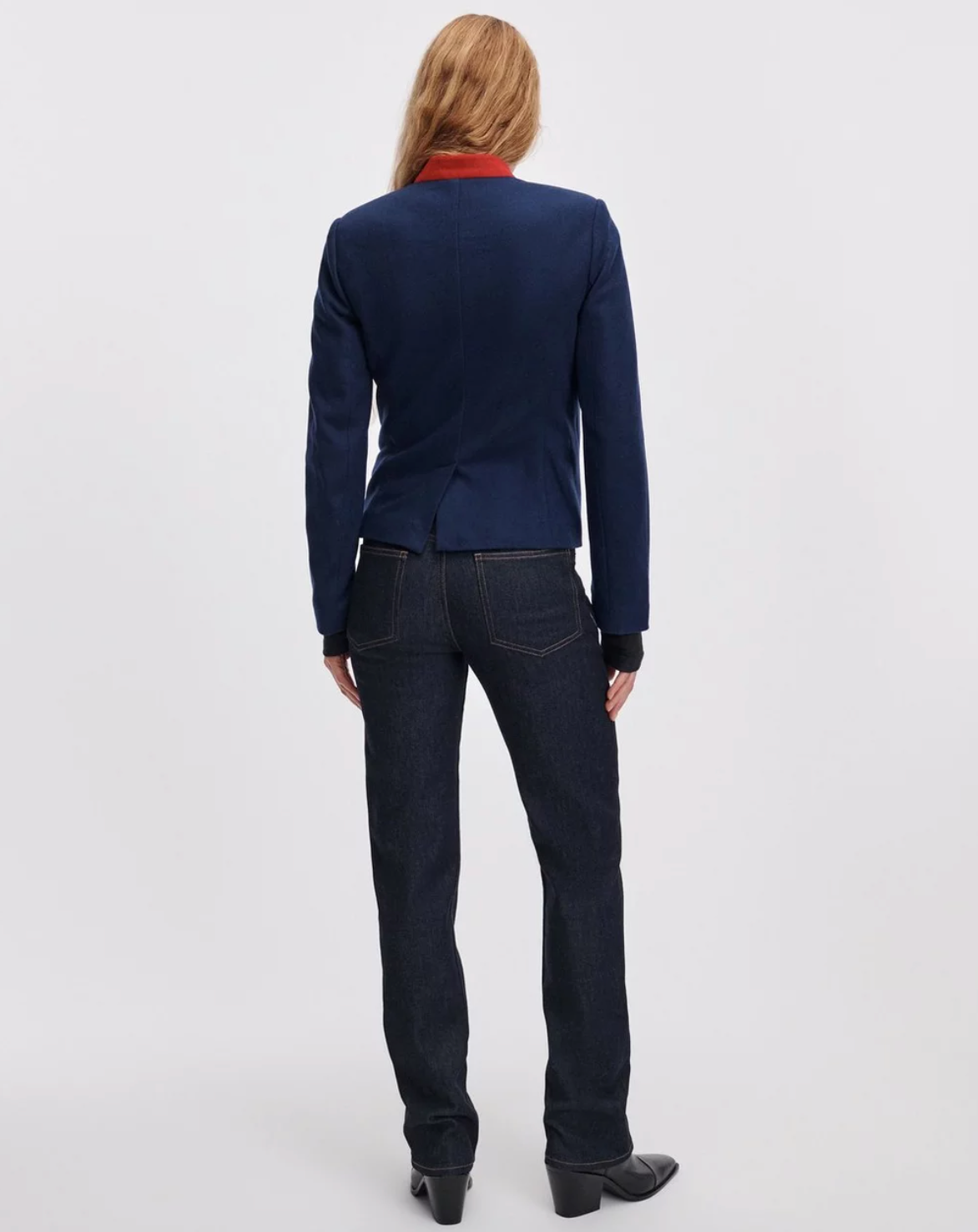 Rag & Bone Sutton Cigarette Jean in blue, styled with a blazer and boots, model shown from the back.