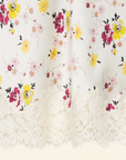 Bias-cut midi skirt with Sweetbriar floral print and scalloped white lace hem by DOEN, feminine and airy style.