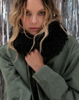 Le Superbe utility anorak in olive green with an oversized black faux-fur collar.
