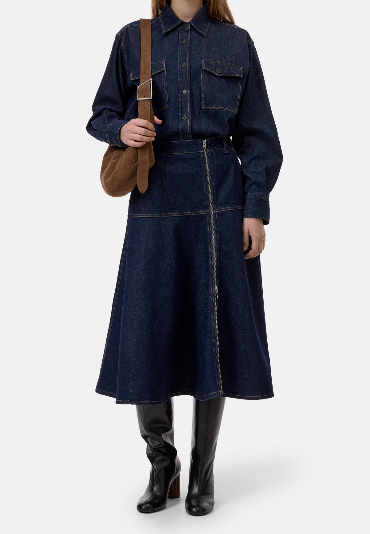 CLOSED Midi Zip Skirt in denim, featuring an asymmetrical front zipper, styled with a matching shirt and suede bag.