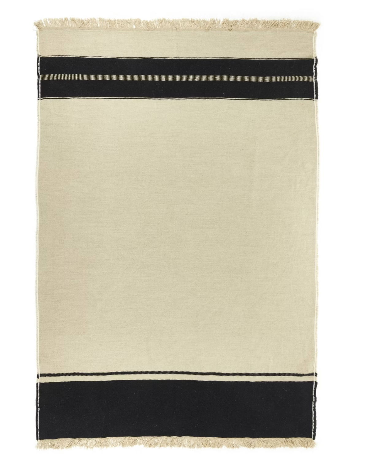 The Marshall Throw by Libeco Home is a rectangular beige linen-wool blend with flax fringe, fringed edges, and two black stripes near the top and bottom for a minimalist, timeless look.