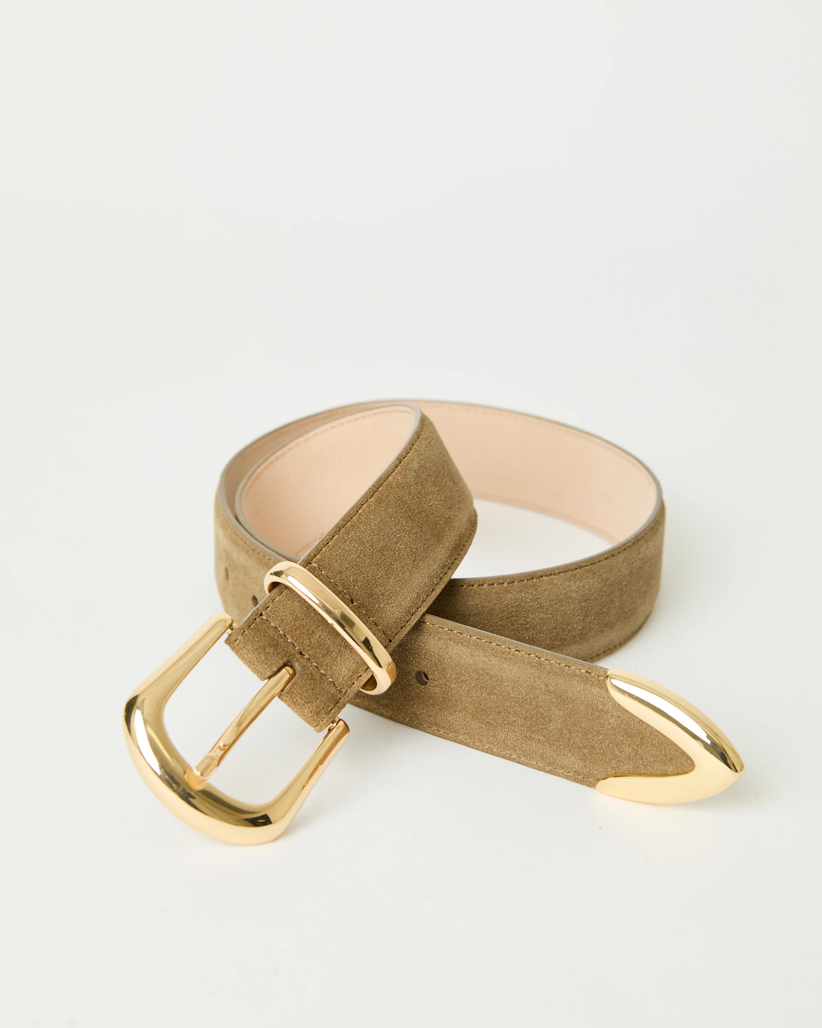 The Marc Belt by B-Low The Belt is a tan suede hip belt made from calfskin leather, featuring gold-tone hardware with a matching gold buckle and tip, displayed in a loose loop on a plain white background.