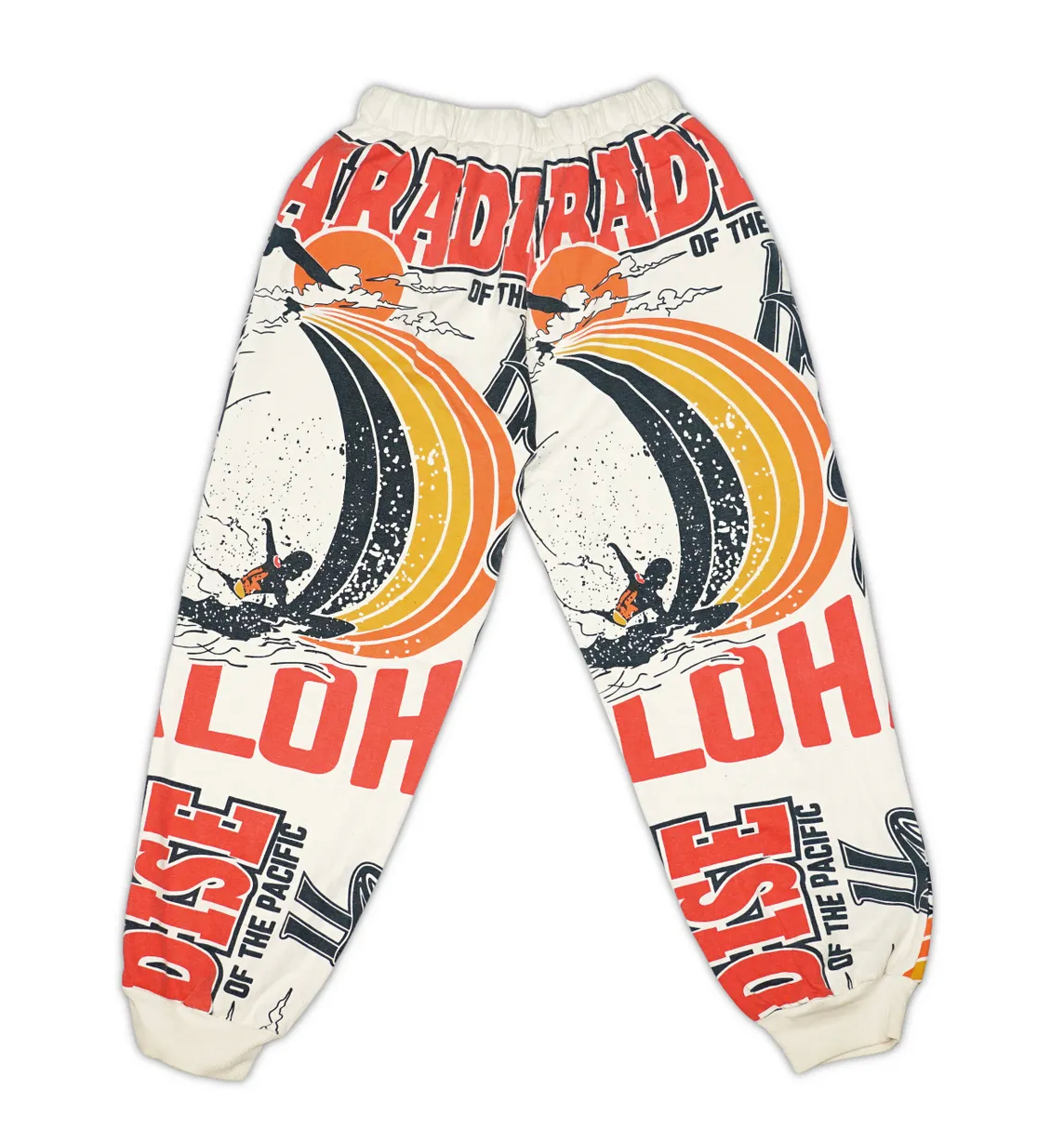 Ping Pong Surf Club's Aloha Paradise Jogers feature a cream hue, bold sailing graphics, waves, and "PARADISE OF THE PACIFIC" and "ALOHA" text—perfect for summer vibes in soft raw cotton.
