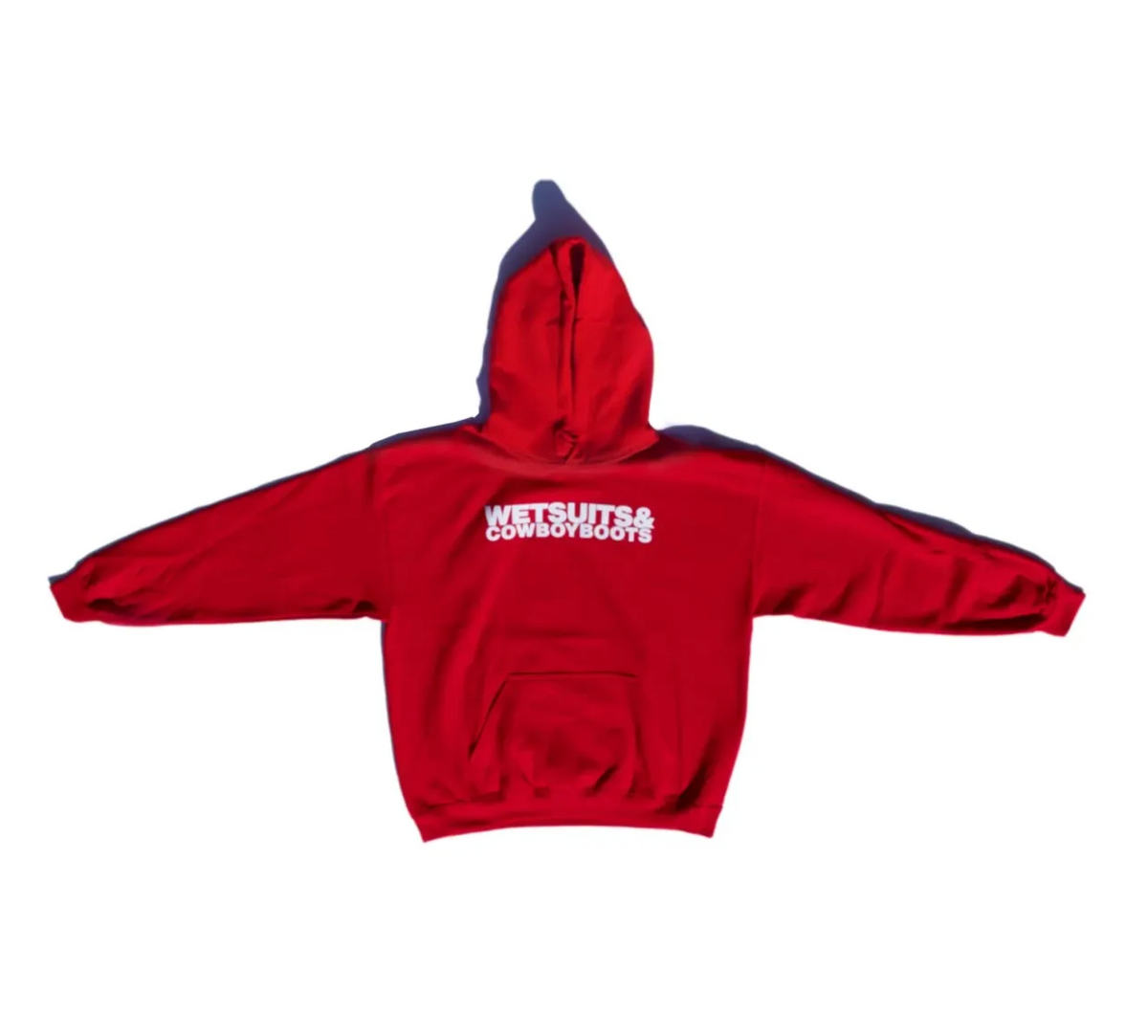 The Ping Pong Surf Club Wet Suit & Cowboy Boots Hoodie is a bright red cotton-poly blend sweatshirt with “WETSUITS & COWBOYBOOTS” in bold white on the back, shown against a plain white background.