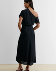 Black Rachel Comey Pout Dress styled with maroon heels, shown from the back against a neutral background.