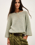 BA&SH Isaac cardigan in cream with olive pants and layered necklaces; effortless, modern style at Bungalow Furniture.