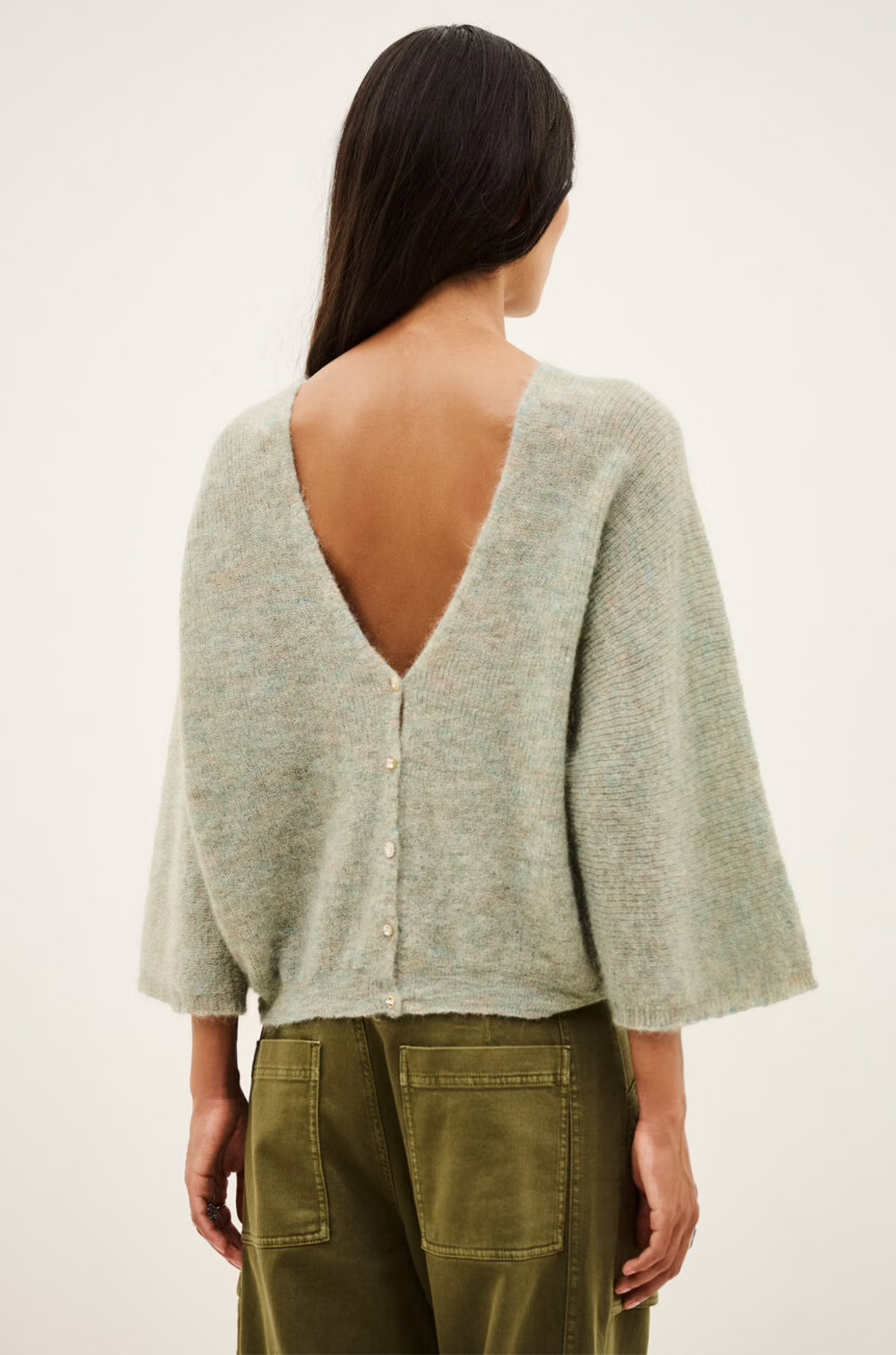 Light gray mohair-alpaca V-neck cardigan with deep V-back by BA&SH, styled with olive pants.