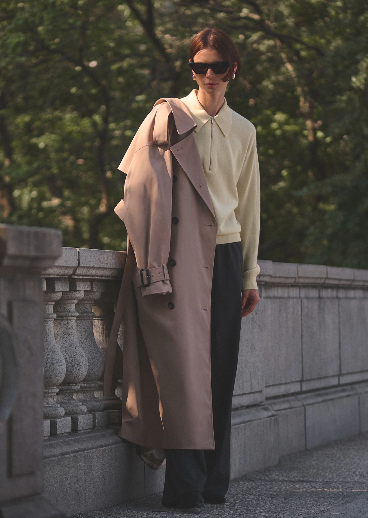 Cashmere Zip Polo by Sold Out NYC styled with dark pants and tan coat, relaxed outdoor setting.