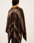 BA&SH Poncho Perros with brown, beige, and burgundy stripes, shown from the back on model with long dark hair.