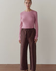 The Taffeta Drawstring Cargo Pant in brown paired with a long-sleeve pink ribbed top.
