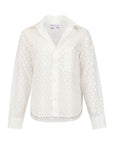 The Daily Shirt by Cissa is a white, long-sleeve button-up with a collar, subtle leaf-pattern eyelets, single chest pocket, and crafted from airy PAPER COTTON for a relaxed, semi-sheer look.