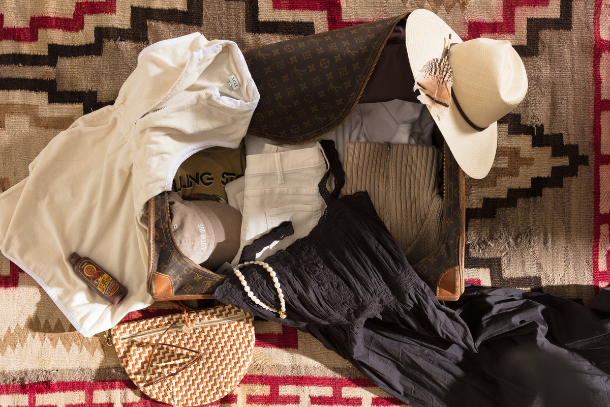 Summer essentials and accessories styled on a patterned rug, Bungalow Furniture & Accessories lifestyle setting.
