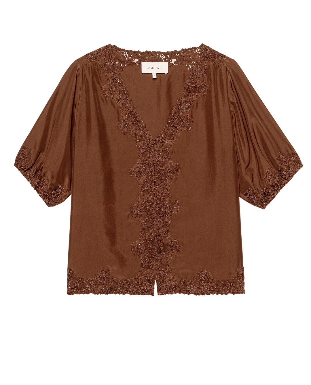 The SS Legacy Top by The Great Inc. is a brown blouse inspired by 1920s loungewear, featuring short puffed sleeves, a V-neckline, and embroidered mesh lace trim on the neckline, front, hem, and sleeves.
