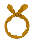 The Scalloped Bandana by The Great Inc. is a mustard yellow fabric headband featuring a knot and two pointed ends at the top, inspired by vintage handkerchief styles.