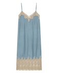 The Great Inc.’s The Legacy Dress is a light blue, vintage-inspired satin slip with thin spaghetti straps and beige embroidered mesh lace trim at the neckline and hem.