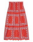 The Great Inc.'s Canary Skirt is a red, knee-length cotton seersucker skirt with a smocked waistband and a blue-and-white nautical border featuring sailboat patterns and grid designs for an airy, breezy look.