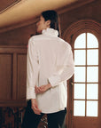 Oversized The Ruffle Neck Shirt with vintage ruffle detail, worn by a person facing away.