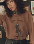 The Great Inc. College Sweatshirt with Stetson graphic, styled with black bandana and hat for a relaxed, casual look.
