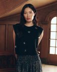 Black sleeveless baby alpaca Embellished Sweater Vest with metallic butterfly details by Bungalow Furniture & Accessories.