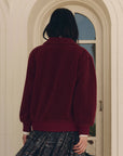 Burgundy plush fleece Patch Pocket Plush Jacket with collar worn over a patterned skirt, Bungalow Furniture & Accessories.