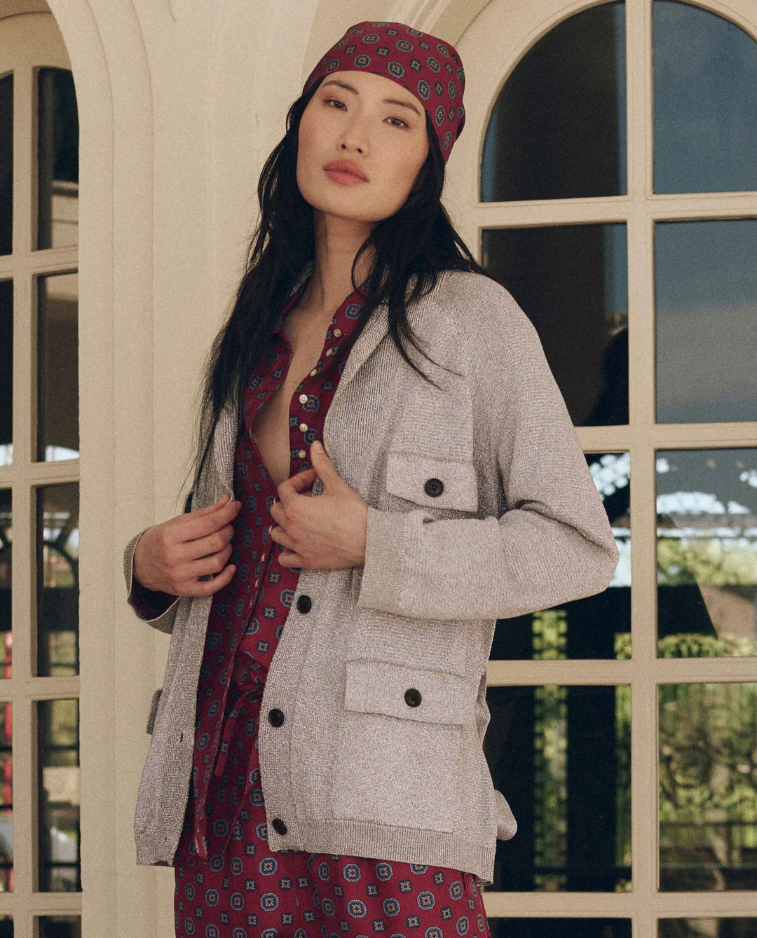 Lurex Commander Riding Cardi worn over a maroon patterned shirt with matching headscarf.