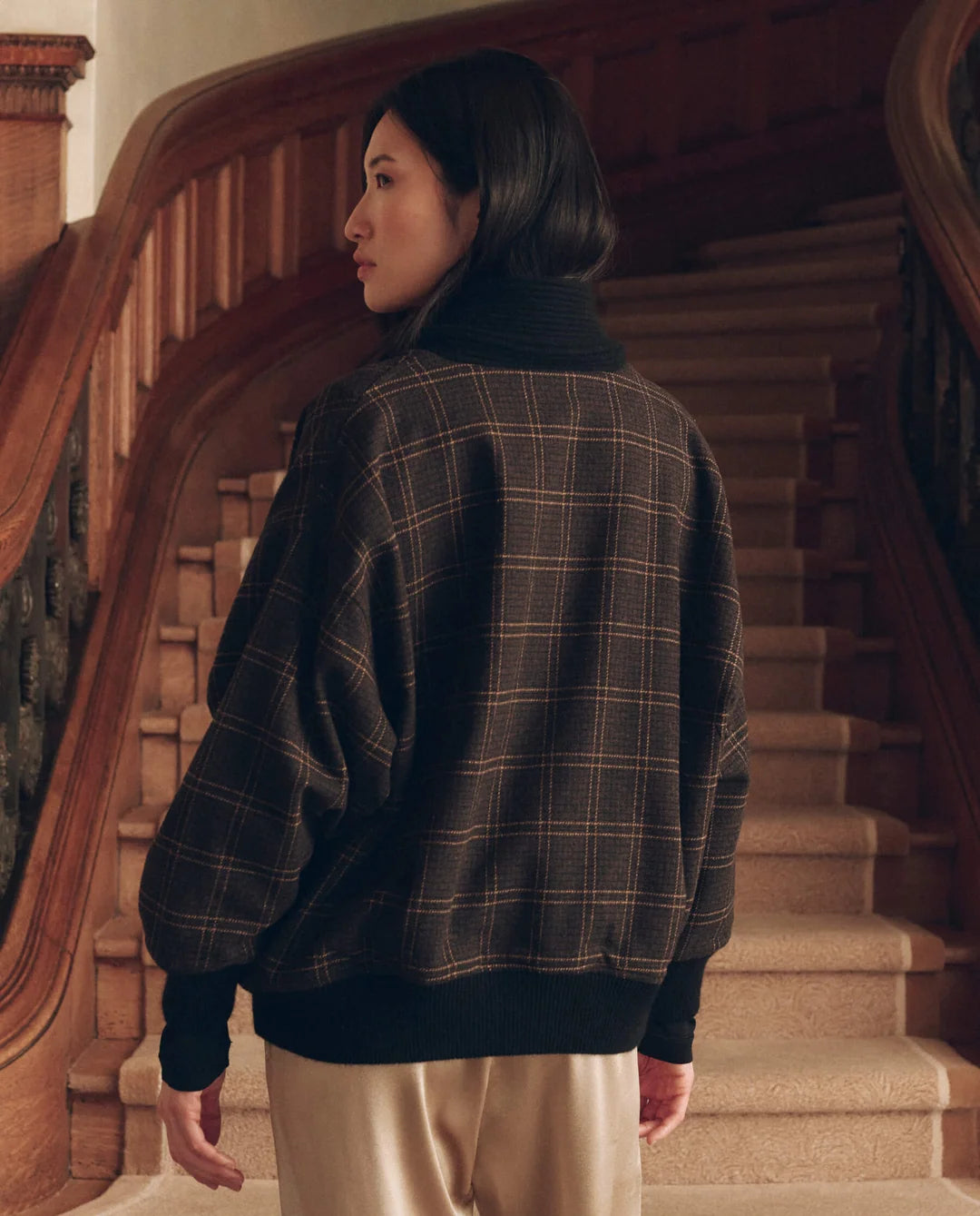 Double Breasted Shawl Collar Coat in brown plaid worn by a person on a staircase.