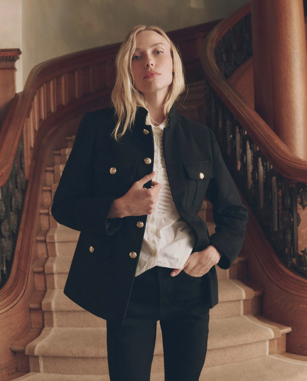 Military Blazer in vintage wool with gold buttons and white ruffled shirt styled on a grand staircase by Bungalow.