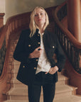 Military Blazer in vintage wool with gold buttons and white ruffled shirt styled on a grand staircase by Bungalow.
