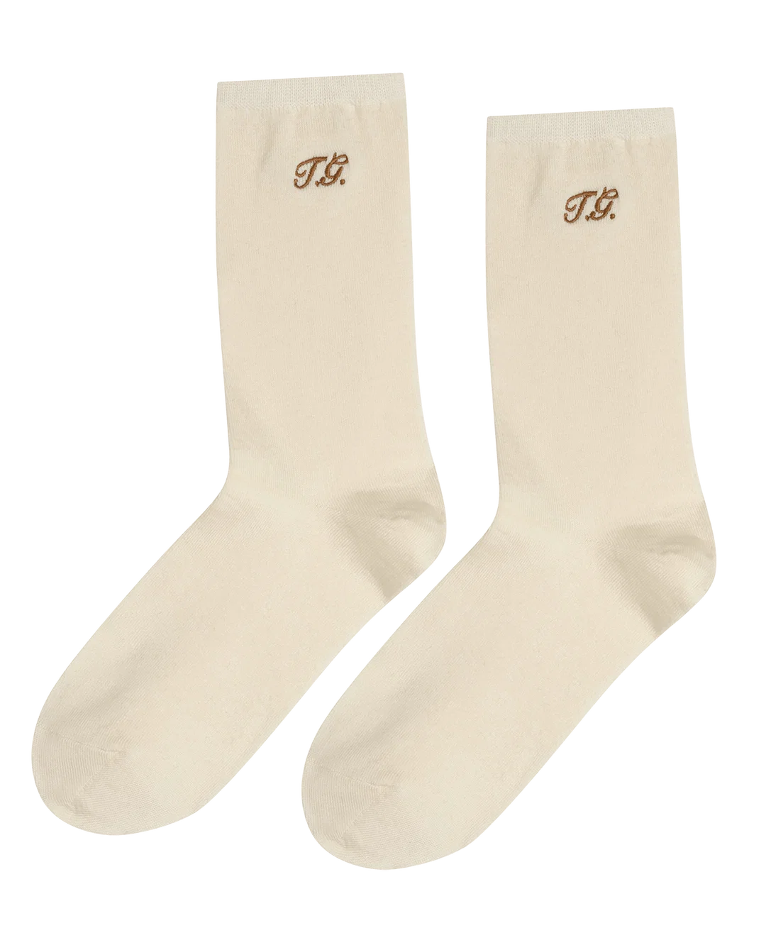Cream trouser socks with brown TG monogram near the top, by The Great Inc., classic finishing touch for any outfit.