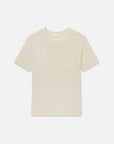 The Knit Plus One Tee by FRAME is a relaxed-fit, light beige short-sleeve t-shirt with a crew neckline and chest pocket, shown on a white background.