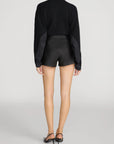 FRAME The Contrast Cashmere Cardi and black leather shorts, shown from behind in a casual setting.