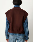 HELSPARK dark brown sleeveless shawl collar jacket layered over a denim jacket.