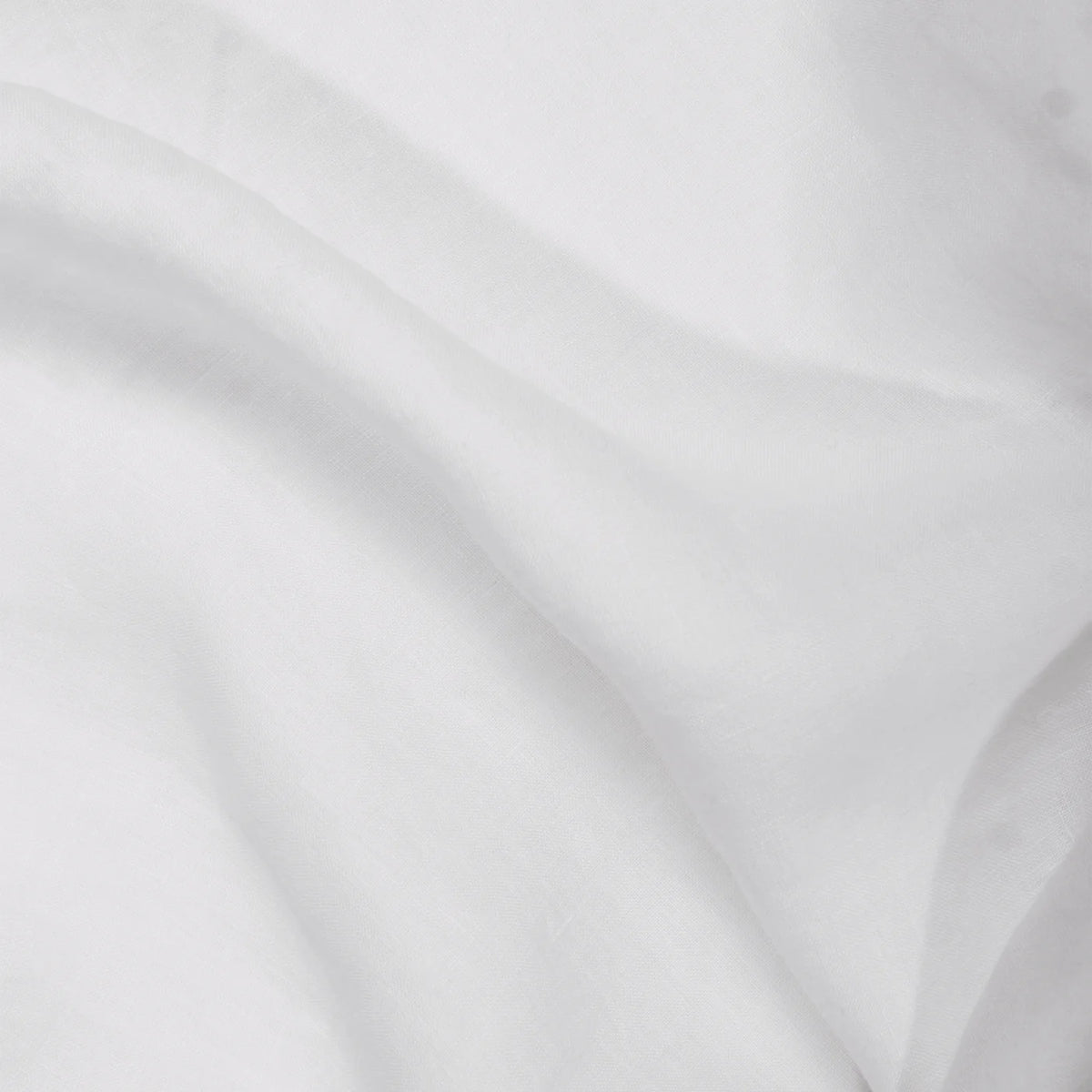A close-up of the Matteo Tat Cotton Sham Euro highlights its white percale weave, gentle wrinkles, soft folds, and smooth texture.