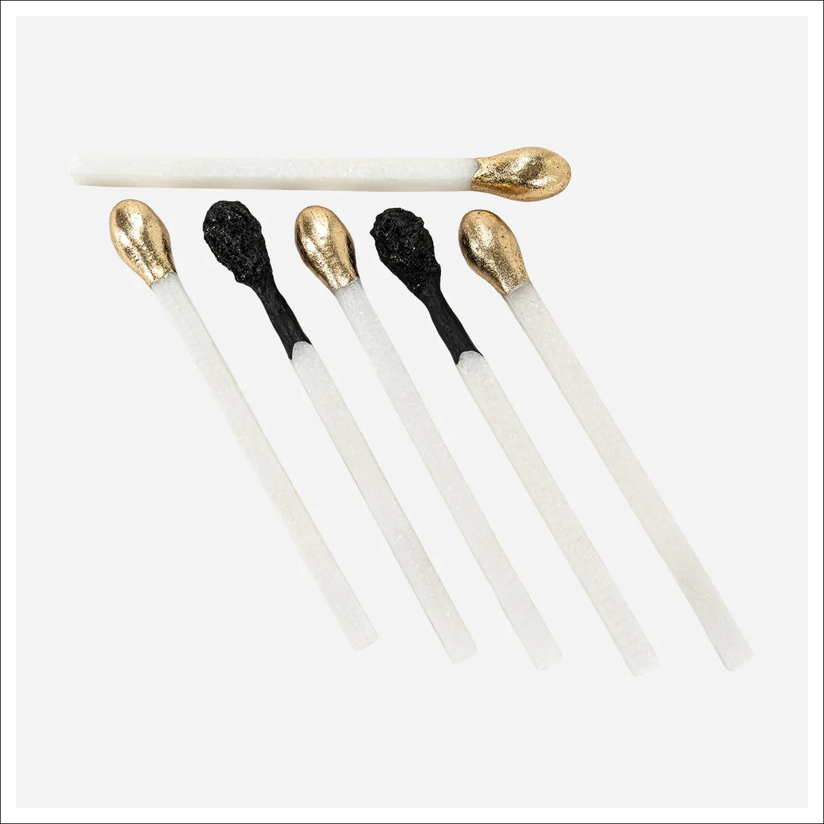 Six Matchstick Sculpture decorative accents with gold or black tips from Bungalow Furniture &amp; Accessories.