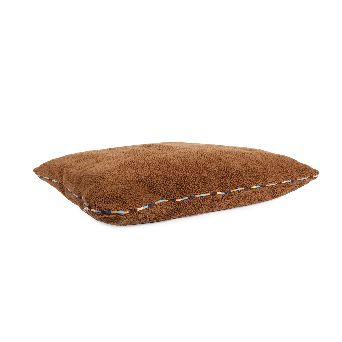 Rust-colored X-Large memory foam dog bed with blue and white patterned trim from Bungalow Furniture & Accessories.