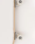 A Faire Vintage Skateboard is shown from the side on a white background, displaying the deck, trucks, and wheels. The sturdy Canadian maple deck ensures durability and a smooth ride.