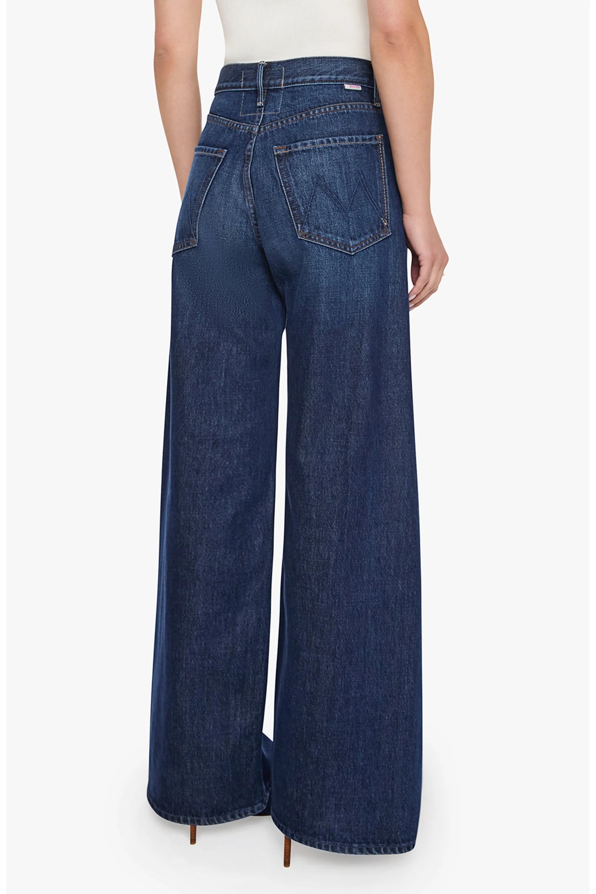 Lil Lemon Twist Sneak high-rise wide-leg dark wash blue denim jeans with twisted seams, back view.