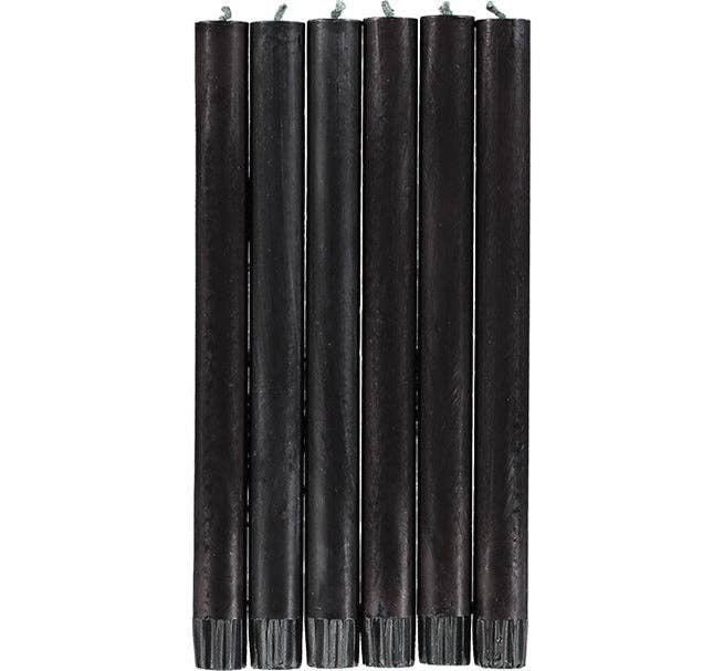 A set of Faire Jet Black Eco Dinner Candles S/2 stands upright against a white background, each slim candle featuring a visible wick at the top.