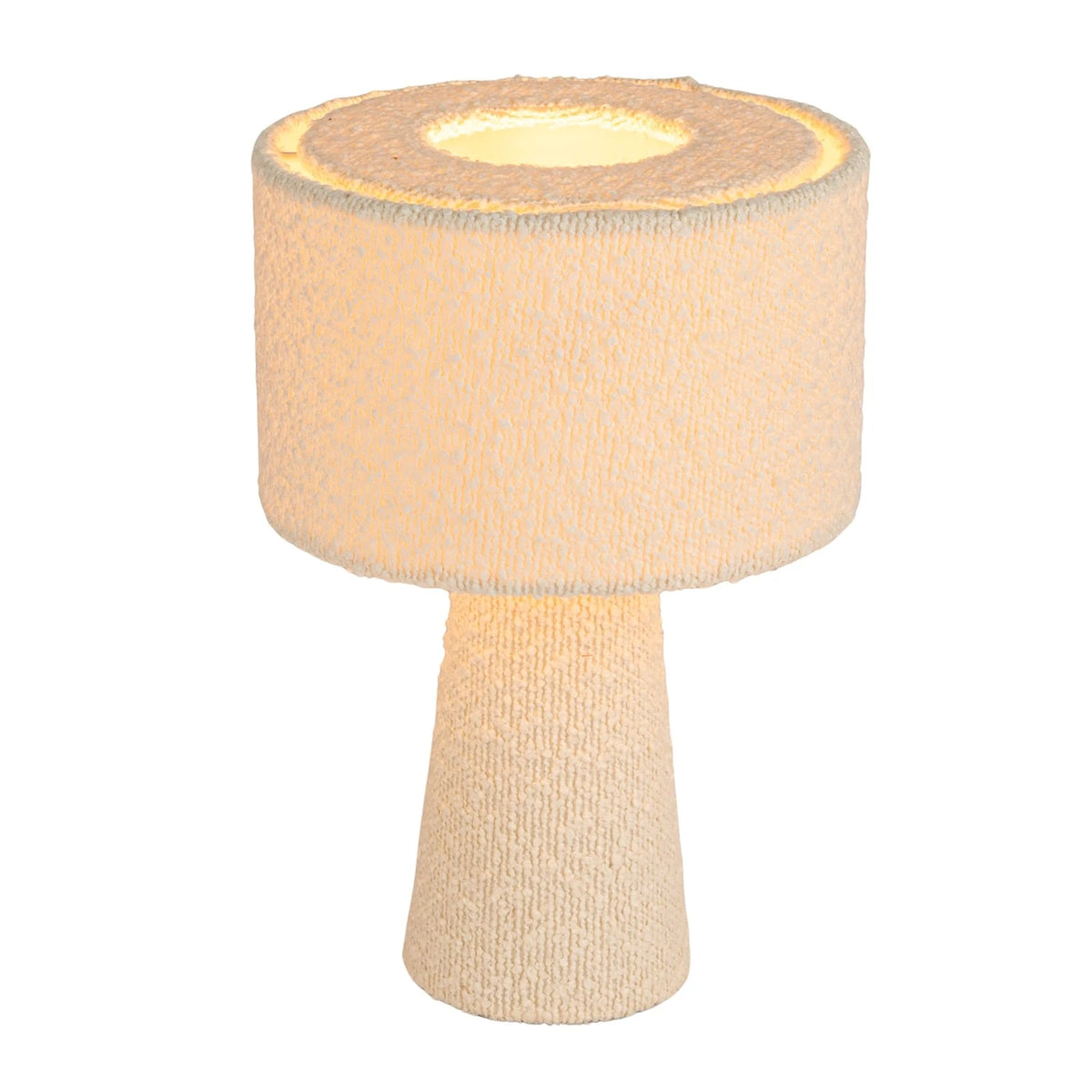 The Bouclé Ivory Fabric Table Lamp by Bloomingville features a textured off-white cylindrical shade and matching conical base in ivory, casting a warm, soft light—perfect for modern interiors.