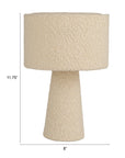 The Bouclé Ivory Fabric Table Lamp by Bloomingville features a textured finish, conical base, cylindrical shade, and measures 11.75" tall by 8" wide. Shown on a white background.