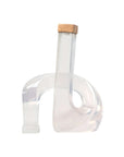 Almeda candleholder with a clear abstract acrylic base and square wooden top by Bungalow Furniture & Accessories.