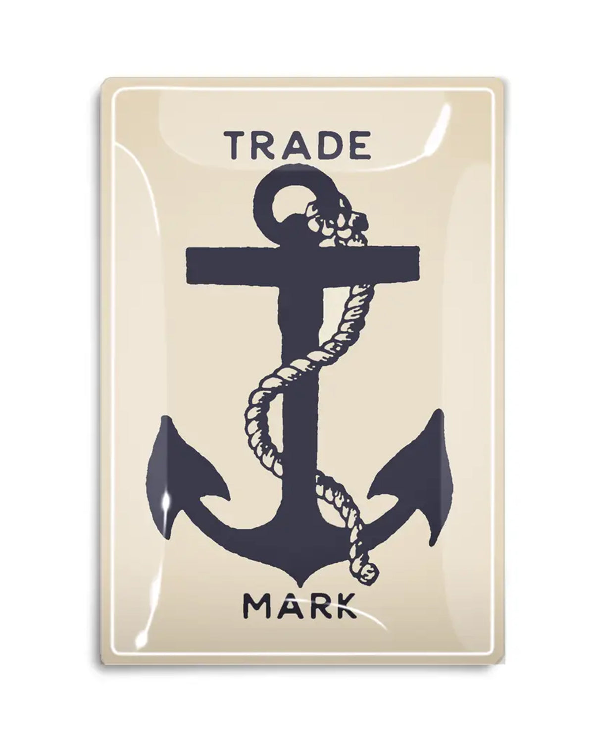 The Faire Shipman's Anchor Glass Tray is a beige rectangular piece featuring a bold black anchor with a coiled rope, “TRADE” above and “MARK” below in black capitals, evoking nautical charm.