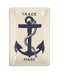 The Faire Shipman's Anchor Glass Tray is a beige rectangular piece featuring a bold black anchor with a coiled rope, “TRADE” above and “MARK” below in black capitals, evoking nautical charm.