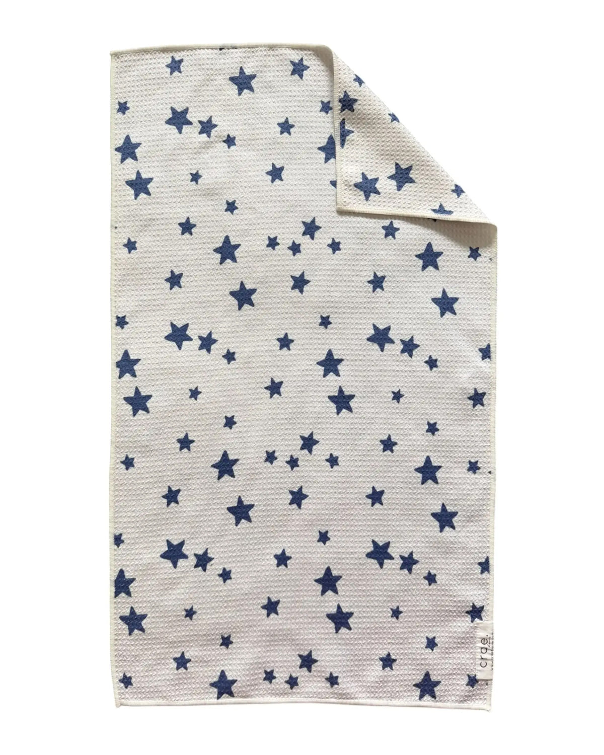 White waffle weave hand towel with blue stars, folded; Annie by Faire, perfect for modern or guest bathrooms.